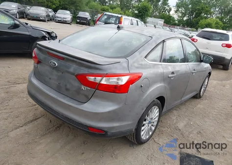 2012 Ford Focus Titanium z USA, uszkodzony, nr VIN 1FAHP3J25CL337174